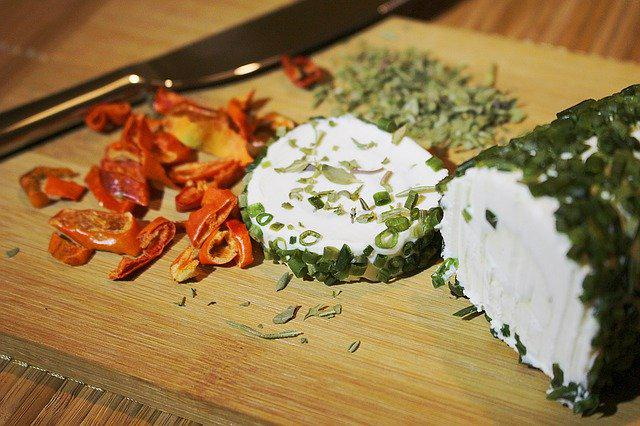 Herbed chevre goat cheese on a wood board